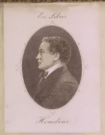 Houdini's bookplace incorporates a profile view of himself, facing left, in an oval frame. He has short curly hair and is wearing a suit and white shirt with a high collar, and a bow tie. Above the frame in cursive are the words "Ex Libris" and below is the name "Houdini".